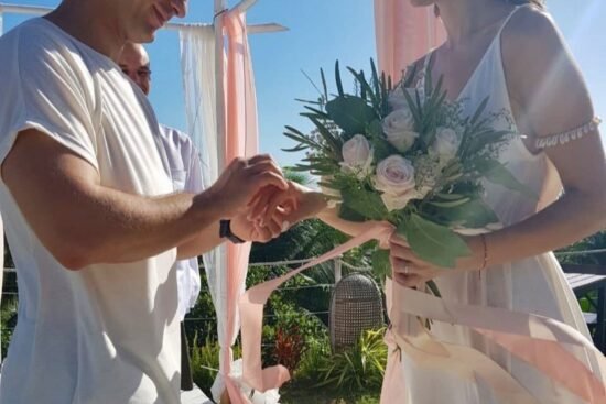 Couple exchanging rings on their wedding day